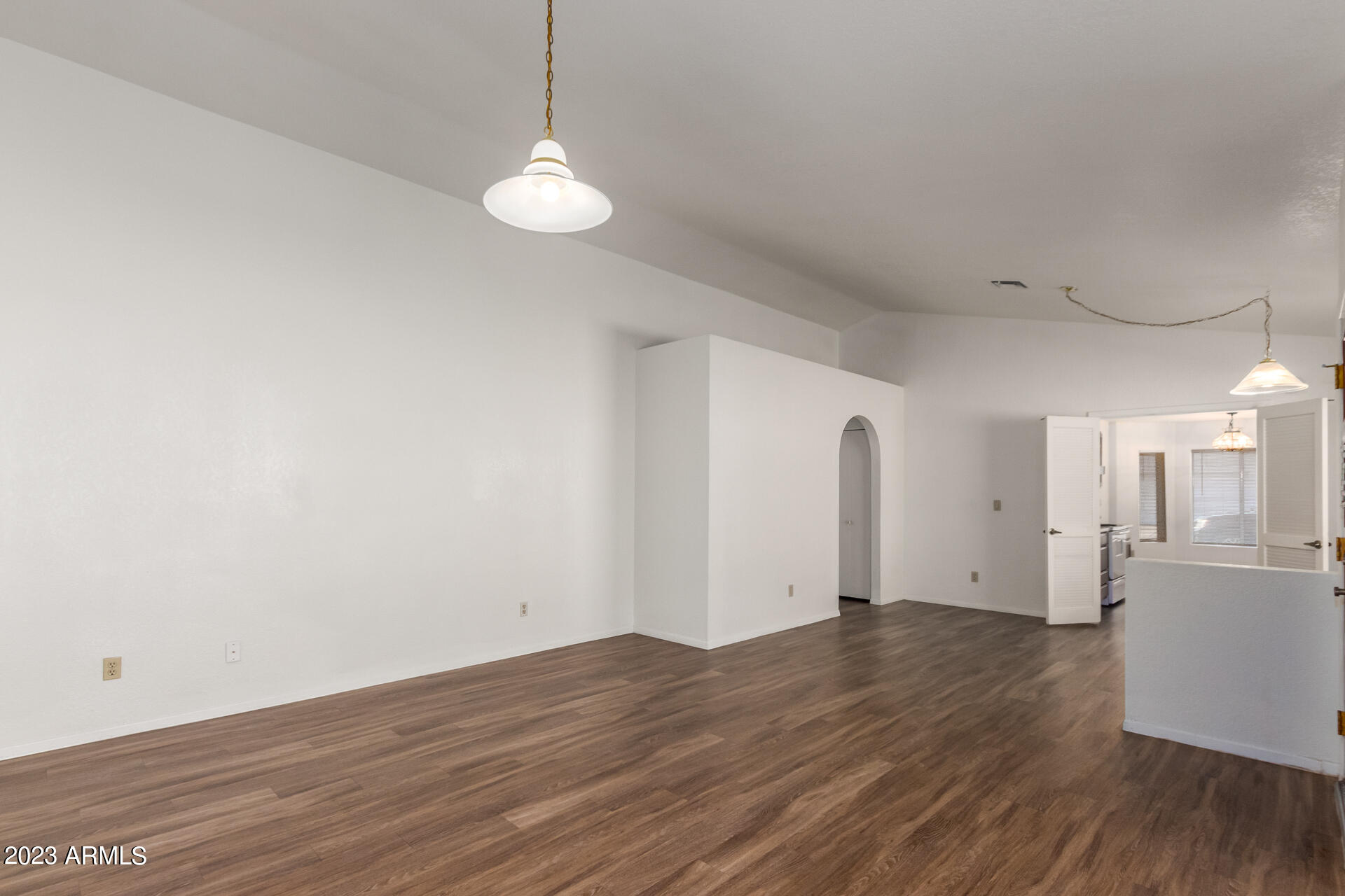 7331 West Paradise Drive Peoria, AZ 85345 - Photo 8 of 27 a view of a room with wooden floor and white walls