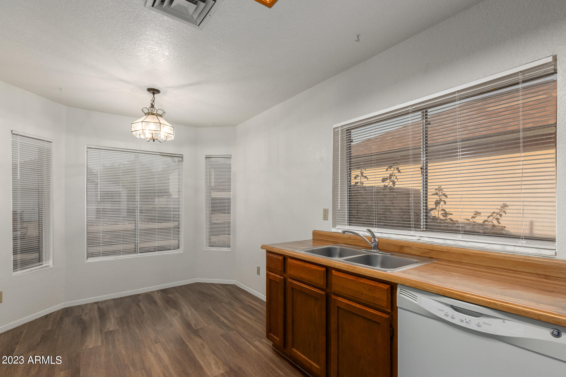 7331 West Paradise Drive Peoria, AZ 85345 - Photo 10 of 27 a kitchen with a sink and a window