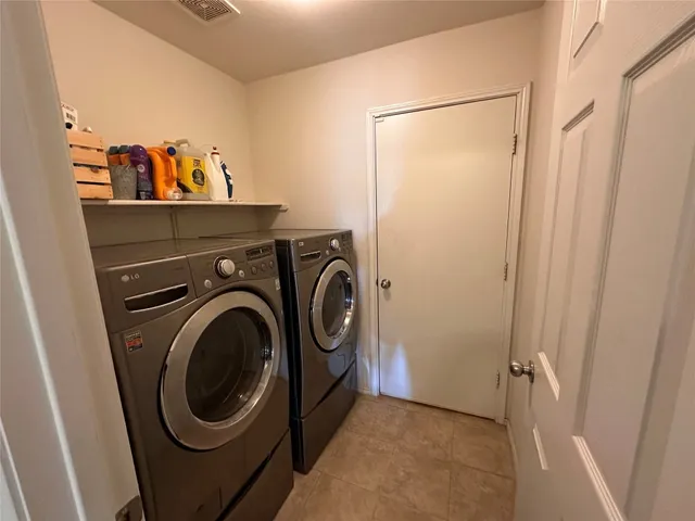 a view of a storage & utility room with washer and dryer