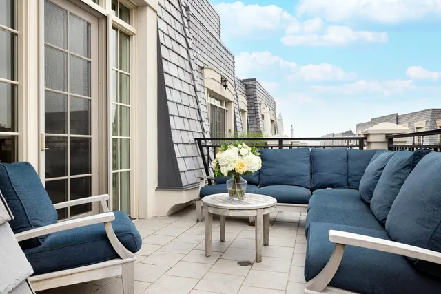a view of a balcony with chairs