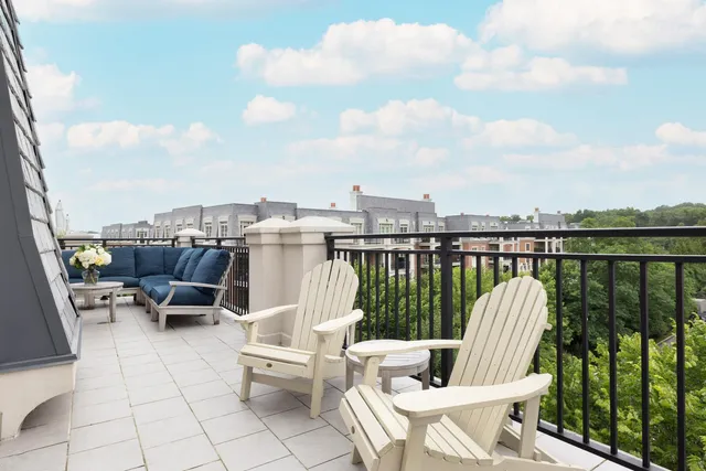 a front view of a residential apartment building with a yard