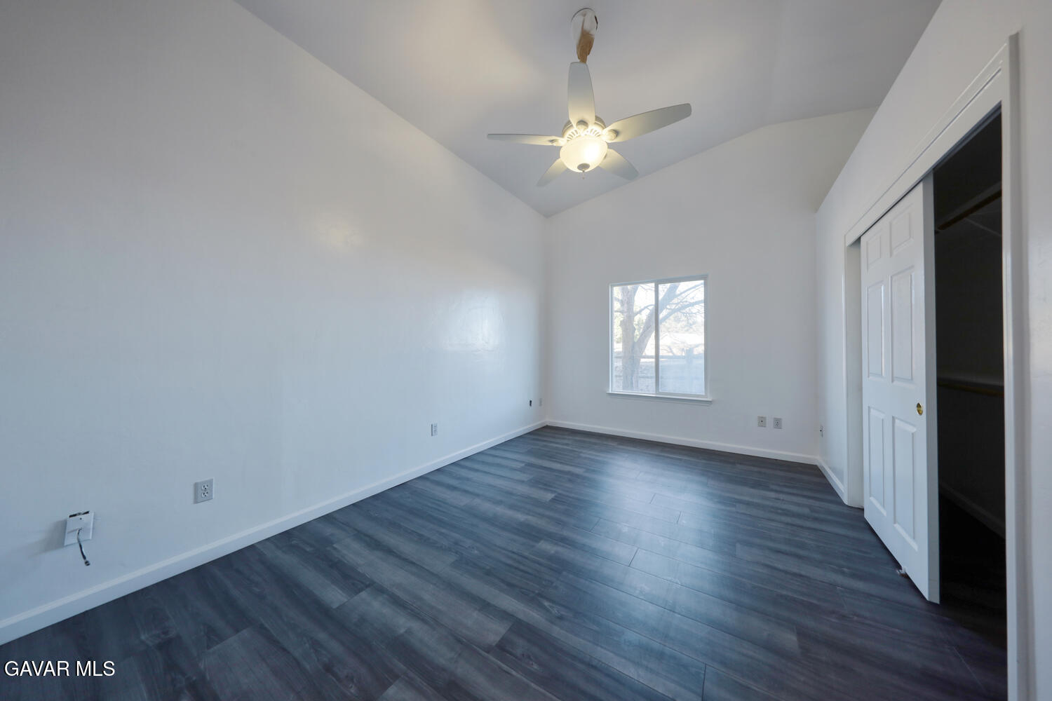 26801 Cabriolet Court Tehachapi, CA 93561 - Photo 32 of 60 an empty room with wooden floor and windows