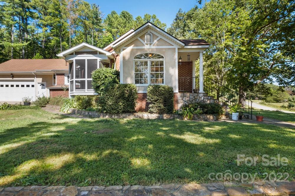 581 Flynn Road Rutherfordton, NC 28139 - Photo 11 of 37 a front view of a house with yard and green space