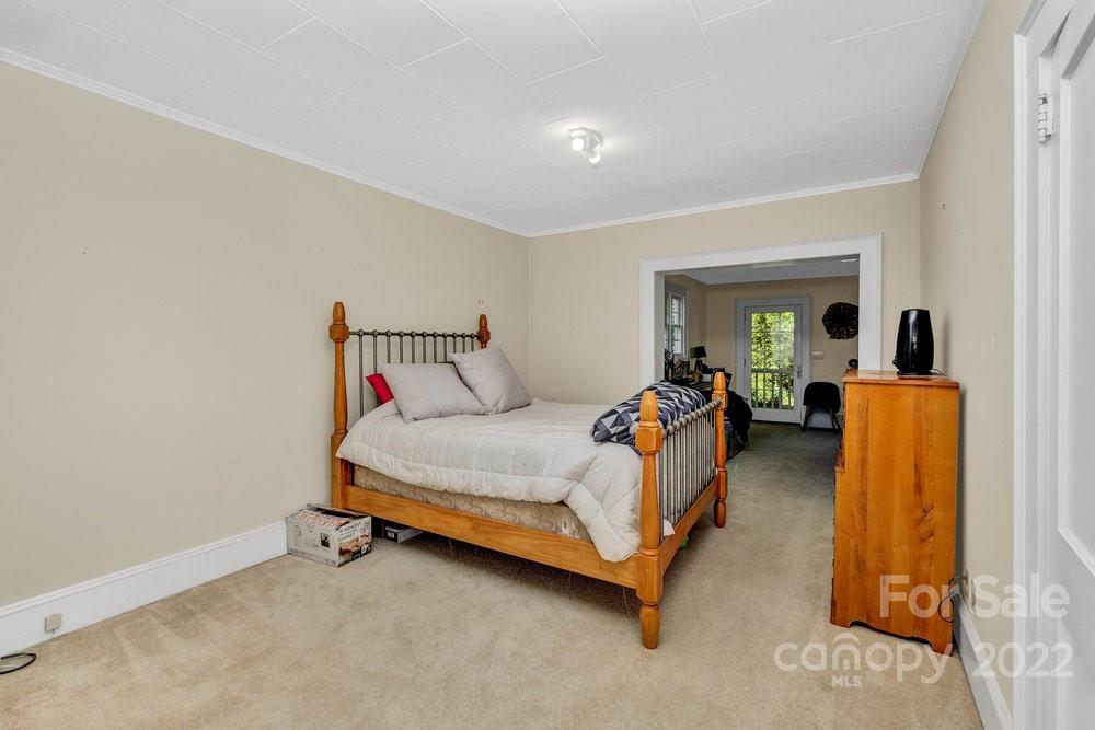 581 Flynn Road Rutherfordton, NC 28139 - Photo 23 of 37 a bed room with a bed and a chair