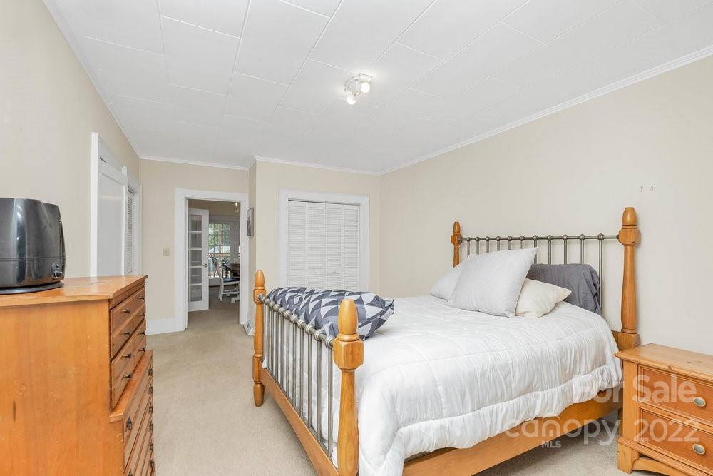581 Flynn Road Rutherfordton, NC 28139 - Photo 26 of 37 a bedroom with a bed and a flat screen tv