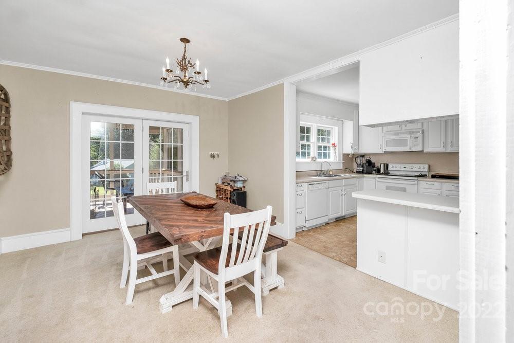 581 Flynn Road Rutherfordton, NC 28139 - Photo 27 of 37 a view of a dining room with furniture window and wooden floor