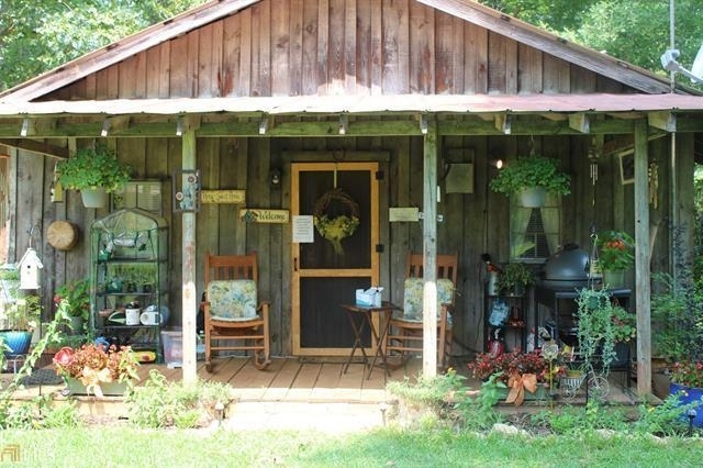 144 Rocky Creek Road Forsyth, GA 31029 - Photo 1 of 1 a small place in front of a building