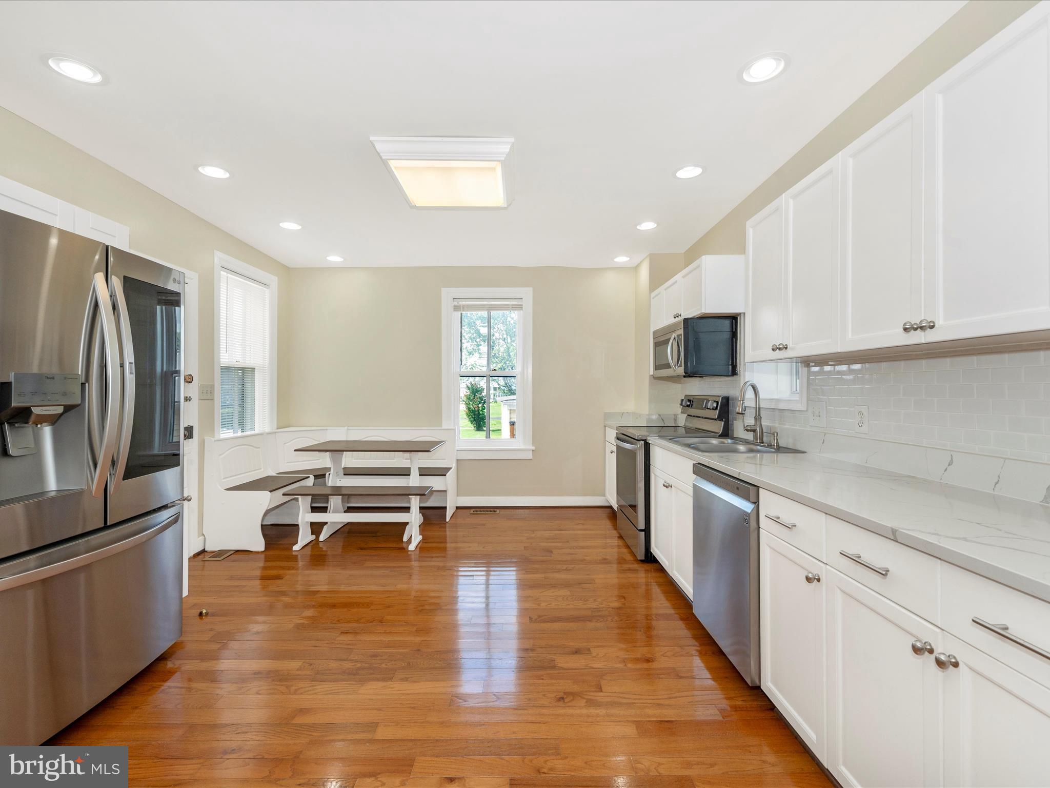 5924 Broad Run Road Jefferson, MD 21755 - Photo 17 of 54 a kitchen with stainless steel appliances kitchen island granite countertop a refrigerator and a stove top oven