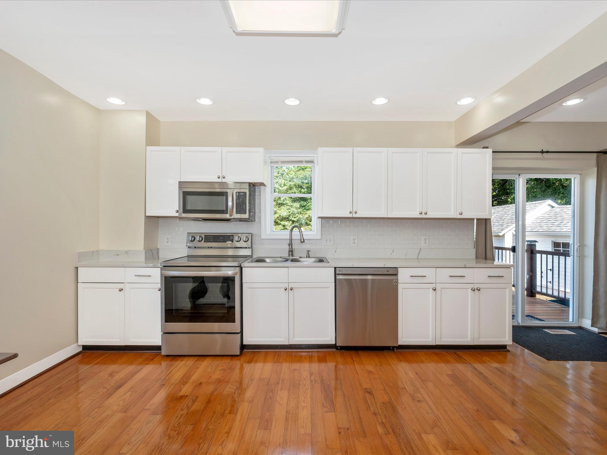 5924 Broad Run Road Jefferson, MD 21755 - Photo 21 of 54 a kitchen with a sink stainless steel appliances and cabinets