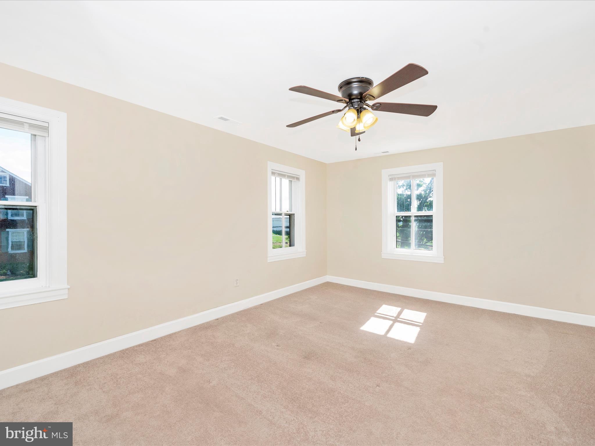 5924 Broad Run Road Jefferson, MD 21755 - Photo 26 of 54 a view of a livingroom with a window and a ceiling fan