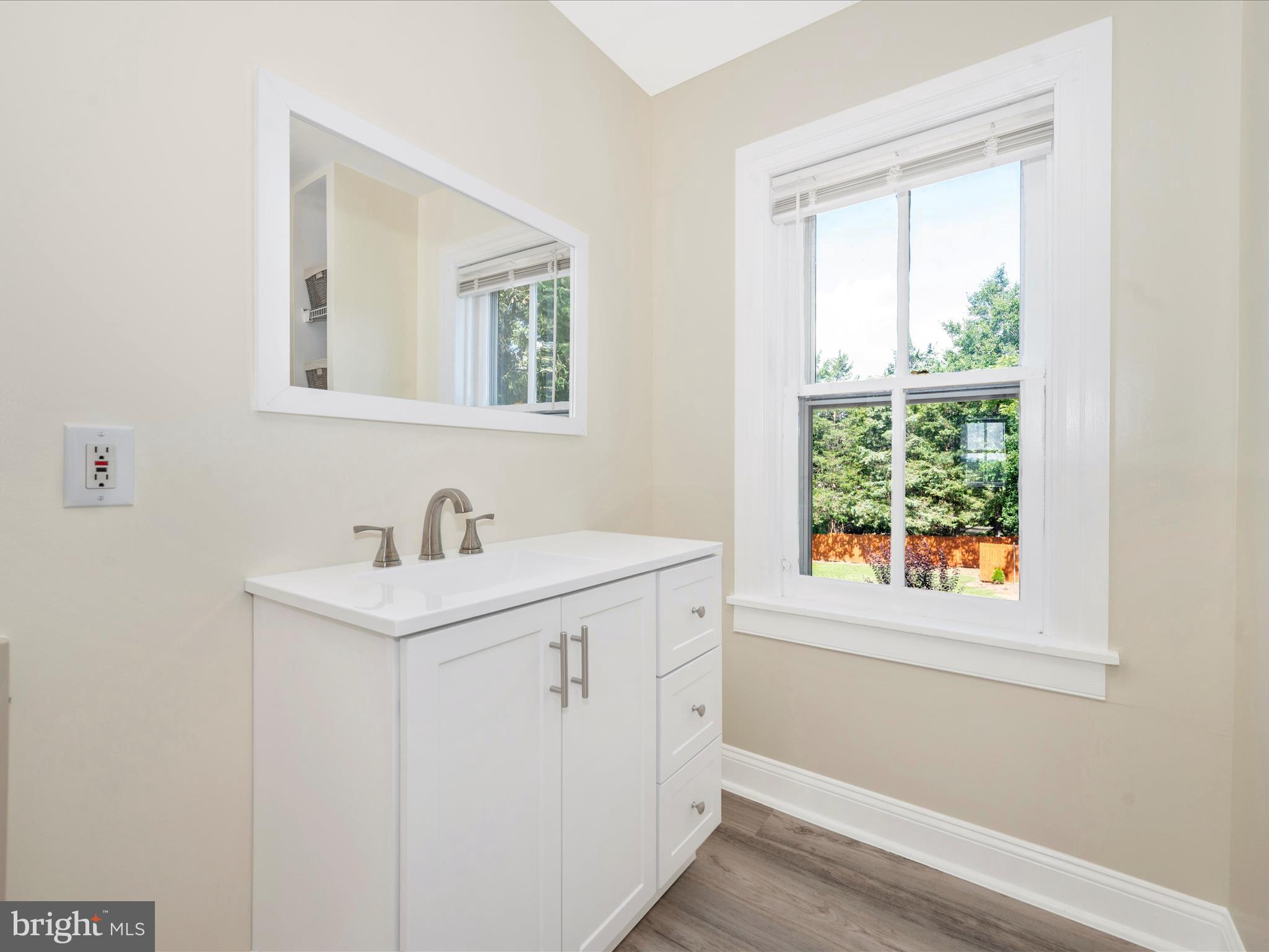 5924 Broad Run Road Jefferson, MD 21755 - Photo 36 of 54 a bathroom with a sink a vanity and a window