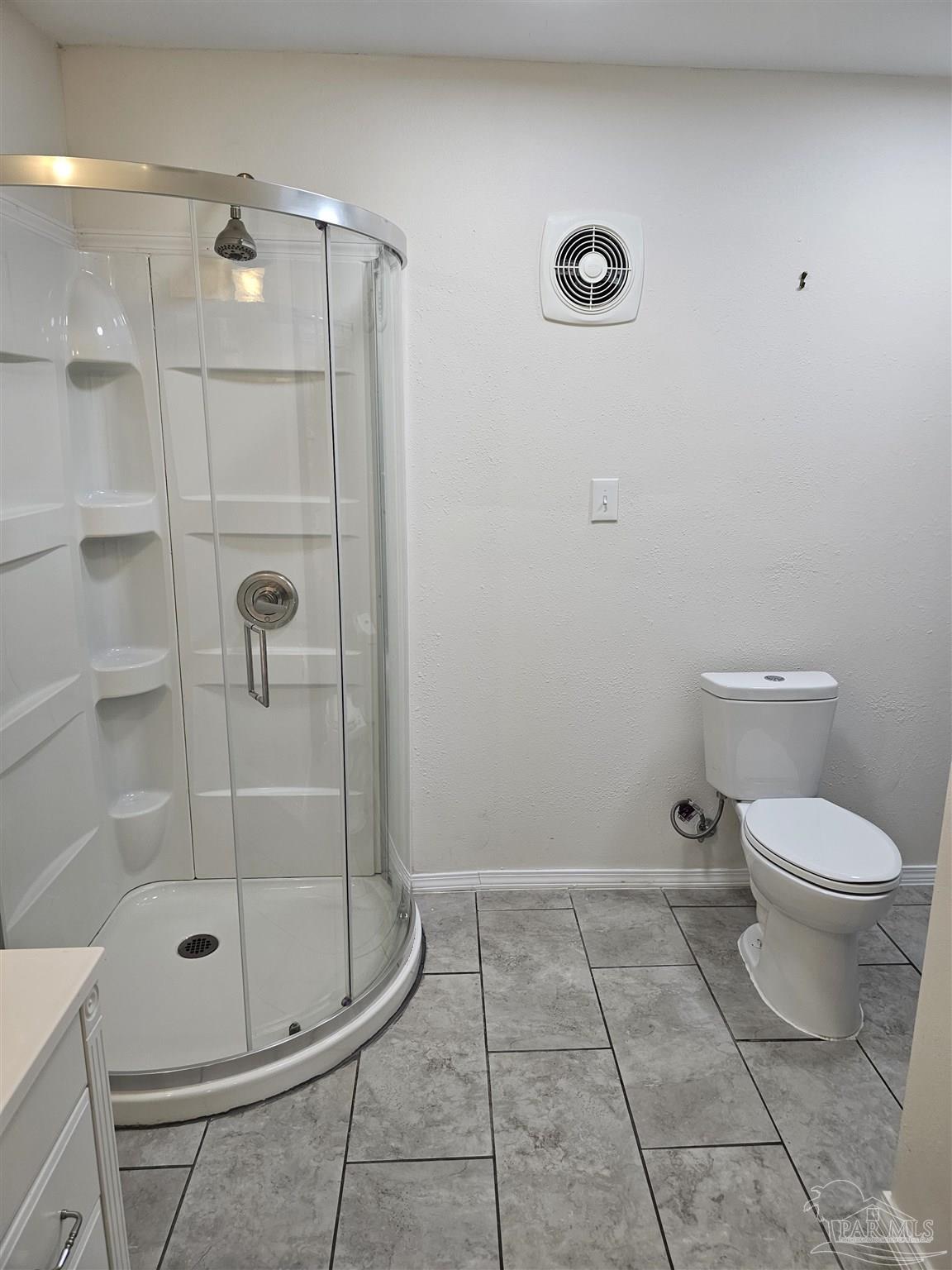 9775 North Loop Road, Unit 1 Pensacola, FL 32507 - Photo 12 of 12 a bathroom with a toilet and a shower