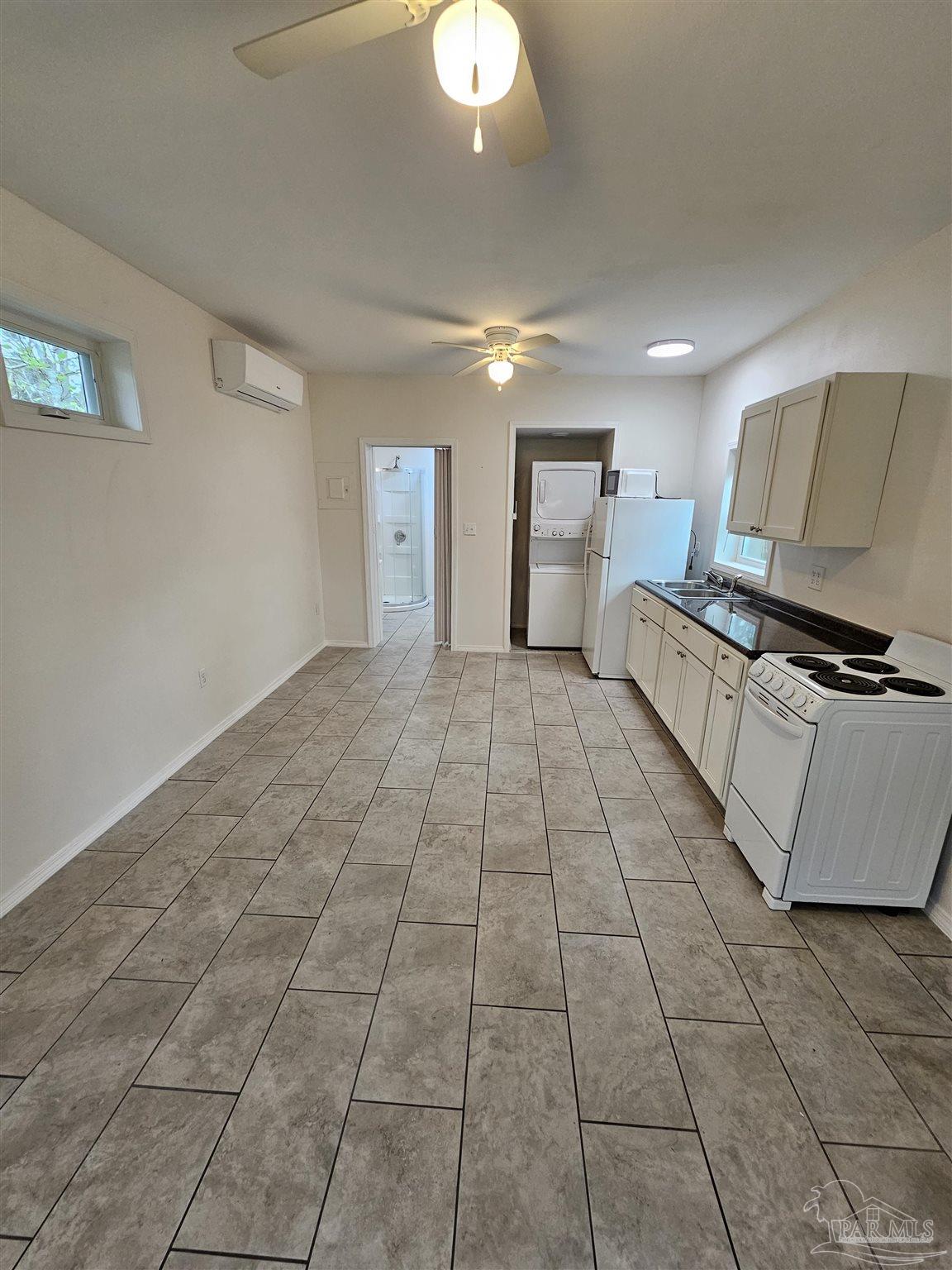 9775 North Loop Road, Unit 1 Pensacola, FL 32507 - Photo 3 of 12 a view of a kitchen with granite countertop cabinets