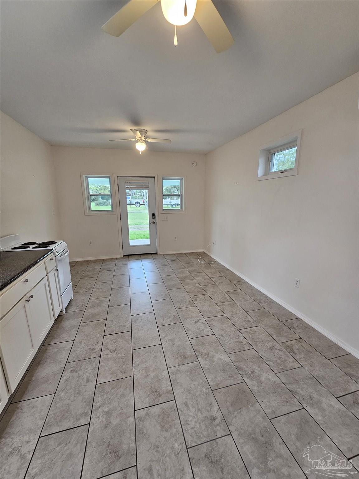 9775 North Loop Road, Unit 1 Pensacola, FL 32507 - Photo 6 of 12 a view of an empty room and window