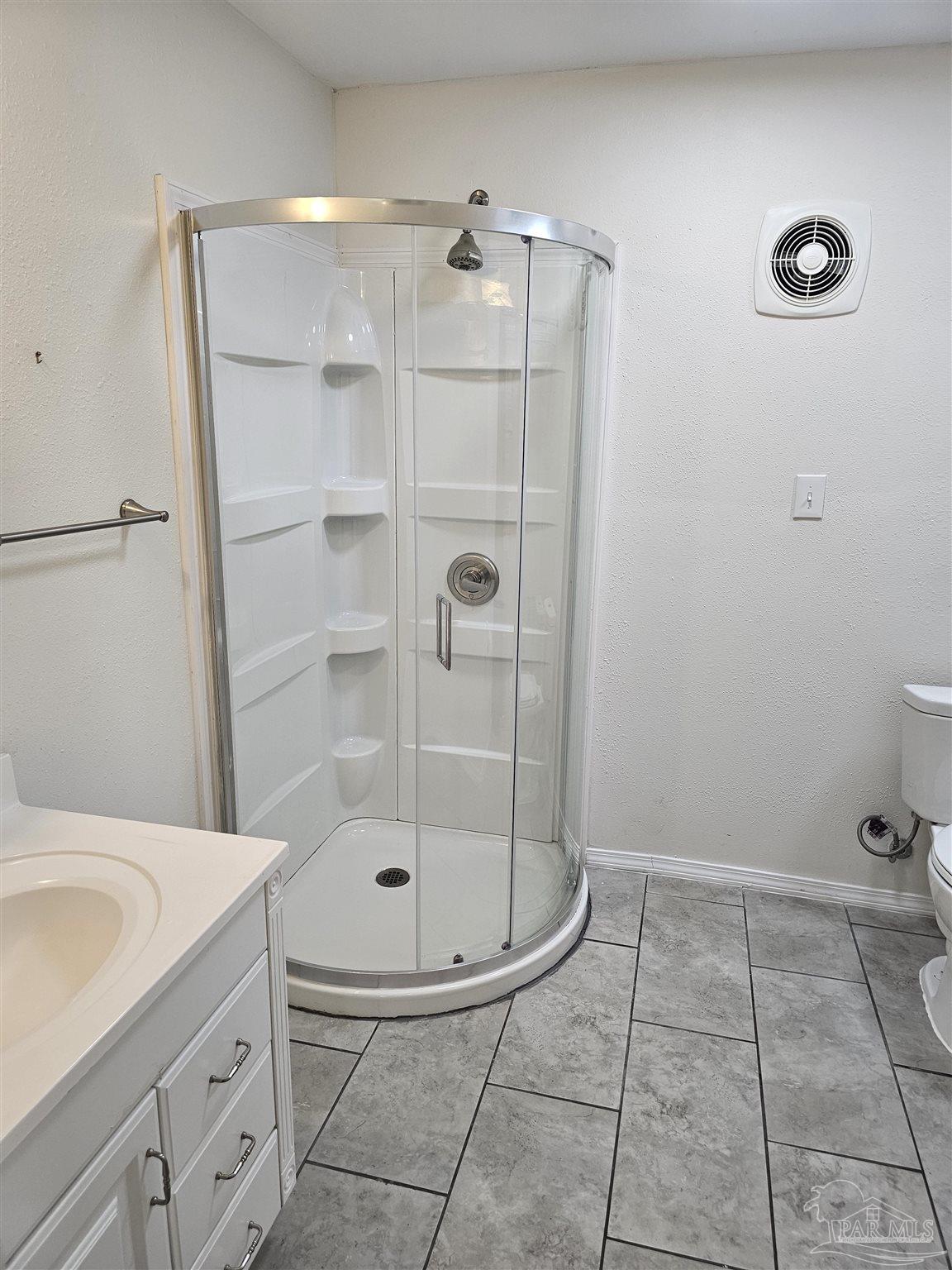 9775 North Loop Road, Unit 1 Pensacola, FL 32507 - Photo 10 of 12 a bathroom with a shower and mirror