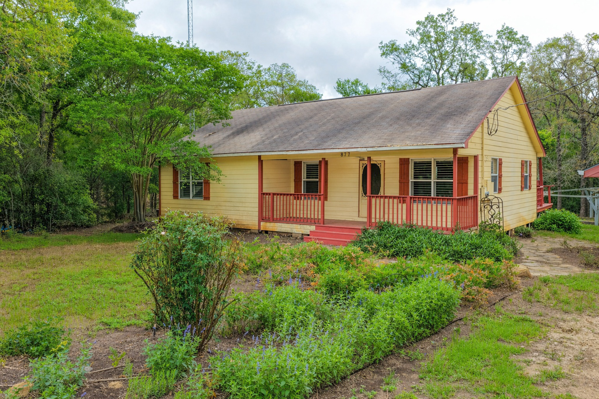 877 Hollow Bend Road, Unit 229 Caldwell, TX 77836 - Photo 14 of 18 a view of a house with garden and yard