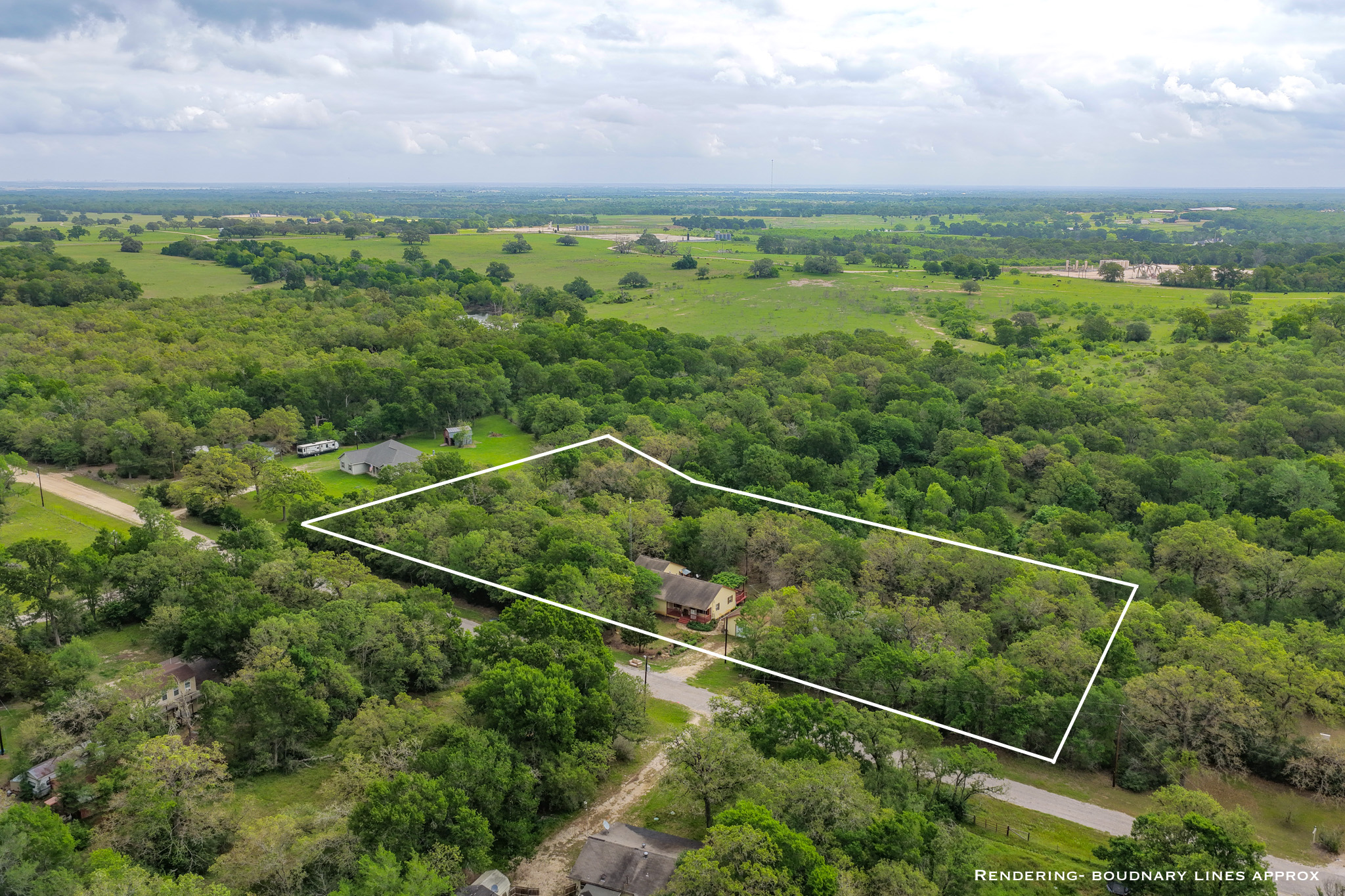 877 Hollow Bend Road, Unit 229 Caldwell, TX 77836 - Photo 17 of 18 a view of a field with a street