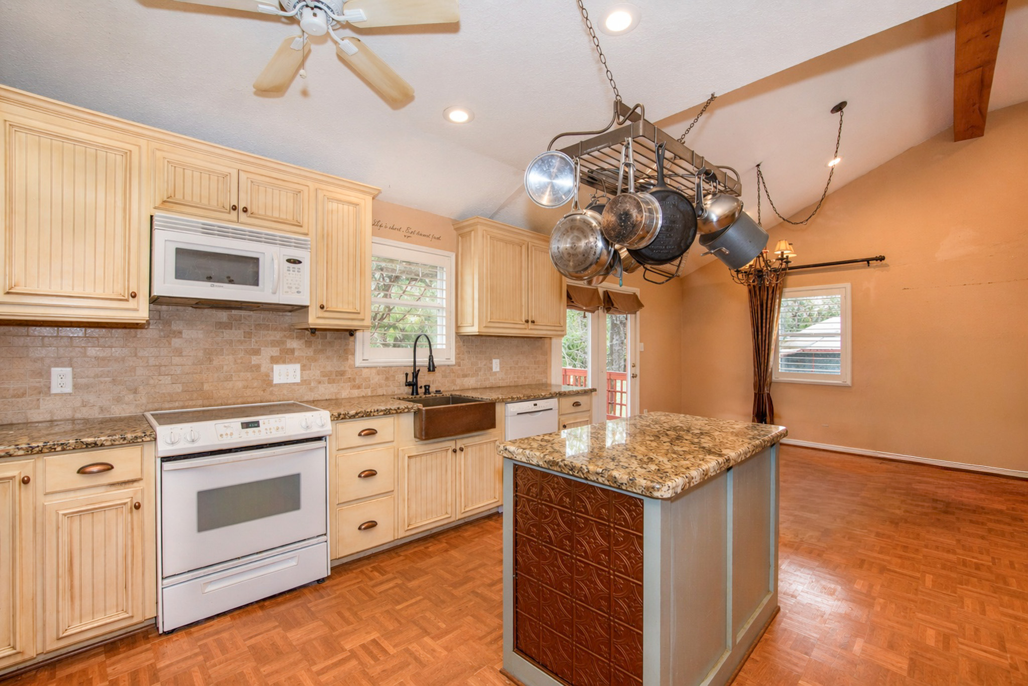 877 Hollow Bend Road, Unit 229 Caldwell, TX 77836 - Photo 4 of 18 a kitchen with stainless steel appliances granite countertop a stove a sink and a microwave