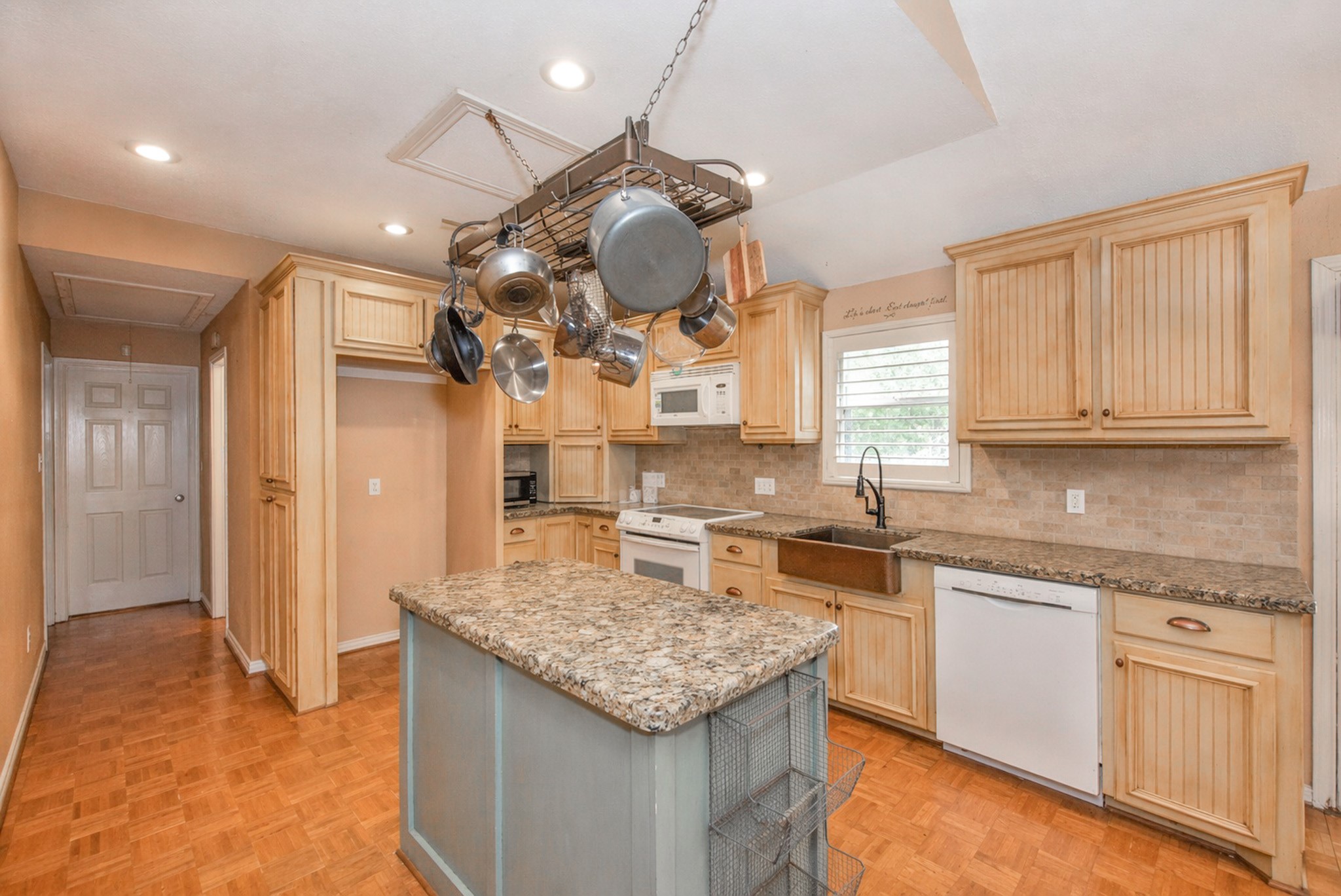 877 Hollow Bend Road, Unit 229 Caldwell, TX 77836 - Photo 5 of 18 a kitchen with a stove cabinets and chandelier