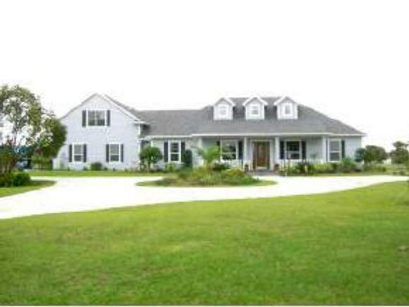 4035 Post Melbourne, FL 32934 - Photo 1 of 6 a front view of a house with a yard