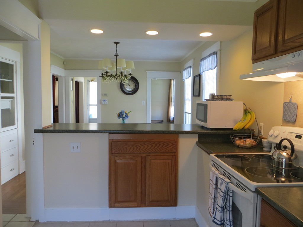 35 Ardmore Street Springfield, MA 01104 - Photo 11 of 19 a kitchen with a sink and a refrigerator
