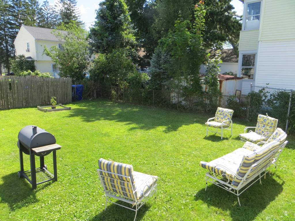 35 Ardmore Street Springfield, MA 01104 - Photo 17 of 19 a backyard of a house with table and chairs