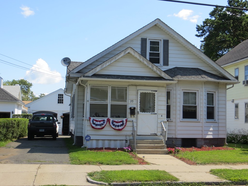 35 Ardmore Street Springfield, MA 01104 - Photo 19 of 19 a front view of a house with a garden and plants