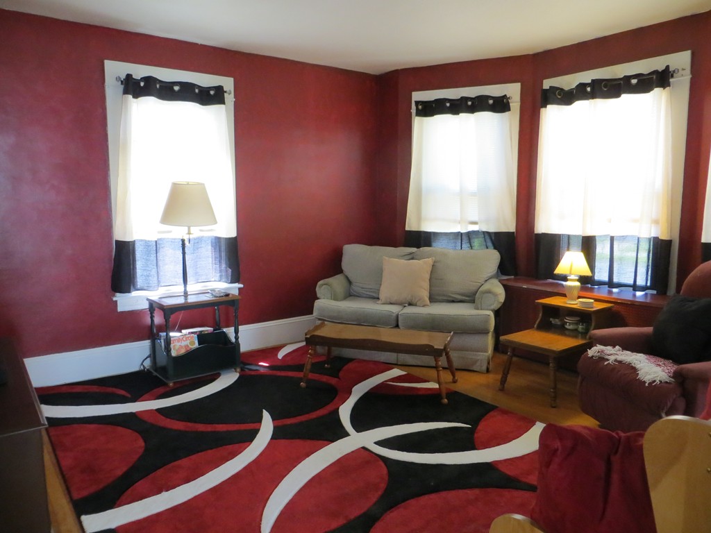 35 Ardmore Street Springfield, MA 01104 - Photo 3 of 19 a living room with furniture and a lamp