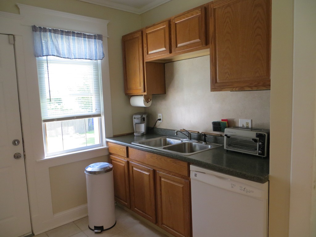 35 Ardmore Street Springfield, MA 01104 - Photo 9 of 19 a kitchen with stainless steel appliances granite countertop a sink stove and cabinets