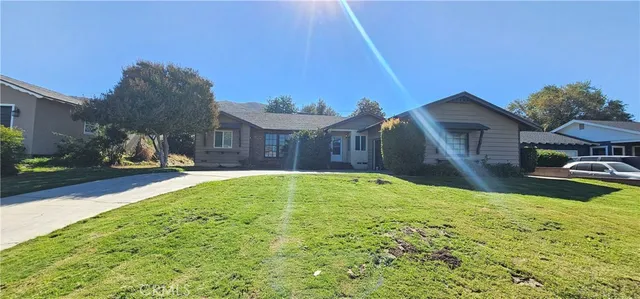 a swimming pool with outdoor seating and yard