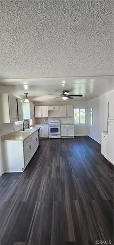 a room with lots of wooden furniture and a view of living room