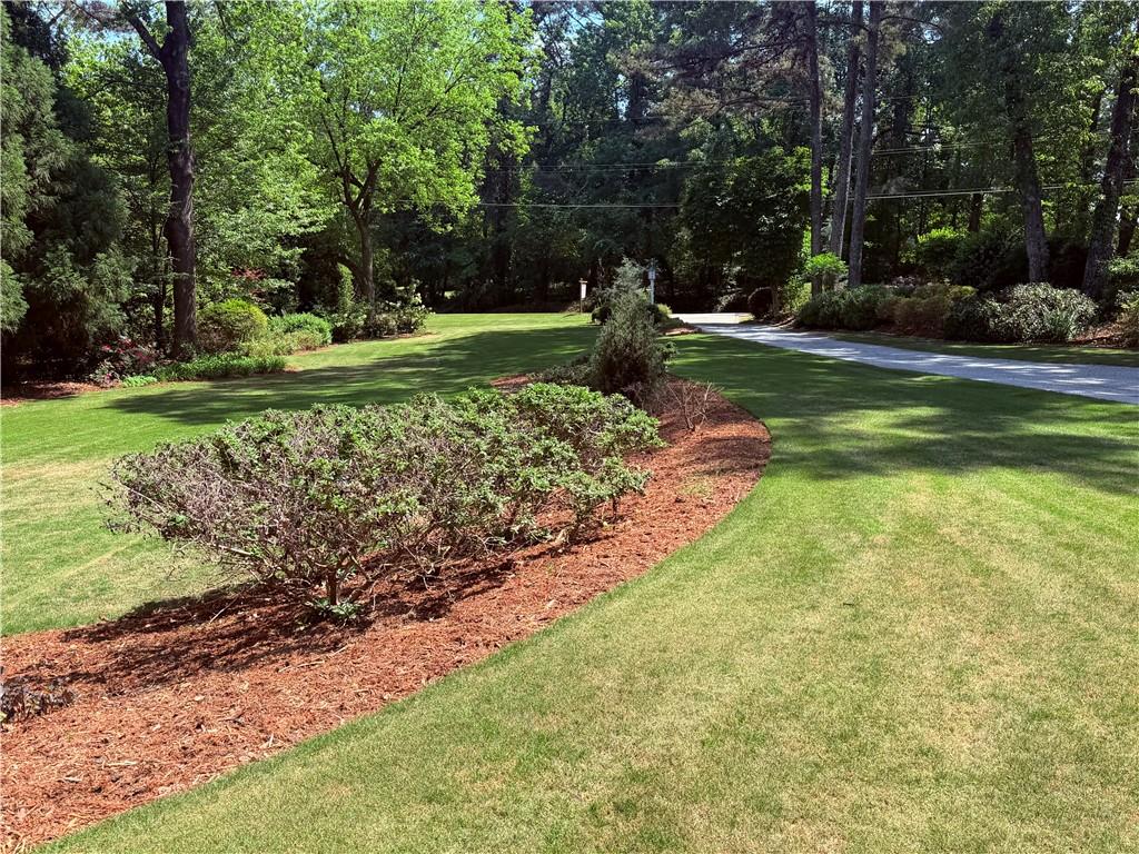 5091 Miller Road Southwest Lilburn, GA 30047 - Photo 3 of 6 a view of a park with large trees