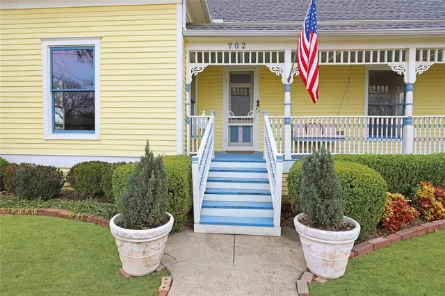 a view of a back yard of the house and a chair