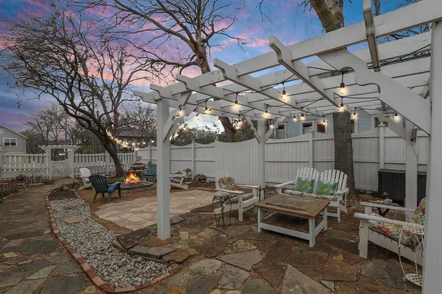 a view of a backyard with sitting area