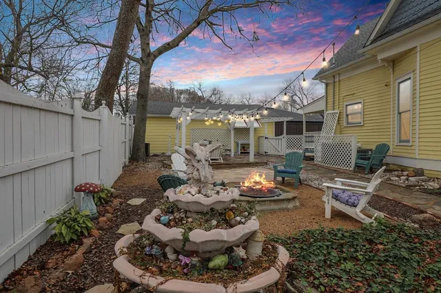 a outdoor living space with furniture and a fireplace
