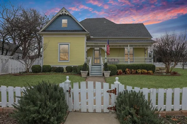 a aerial view of a house with a yard