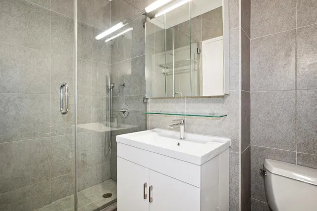 a bathroom with a sink a toilet and bathtub