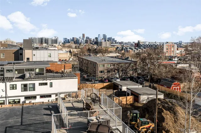 an aerial view of residential house with parking