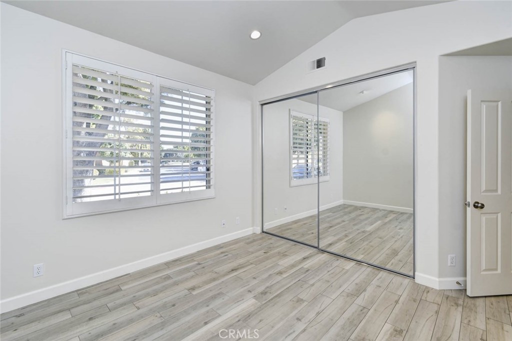 1 La Ronda Irvine, CA 92606 - Photo 14 of 29 a view of an empty room with wooden floor and a window