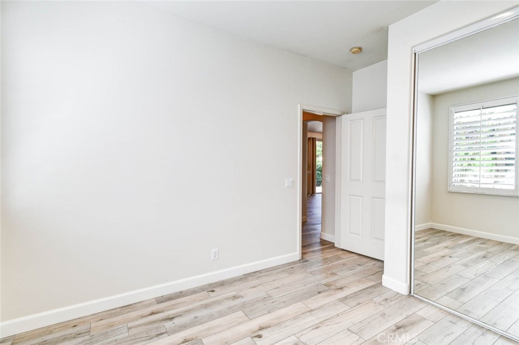 1 La Ronda Irvine, CA 92606 - Photo 19 of 29 a view of an empty room with wooden floor and closet