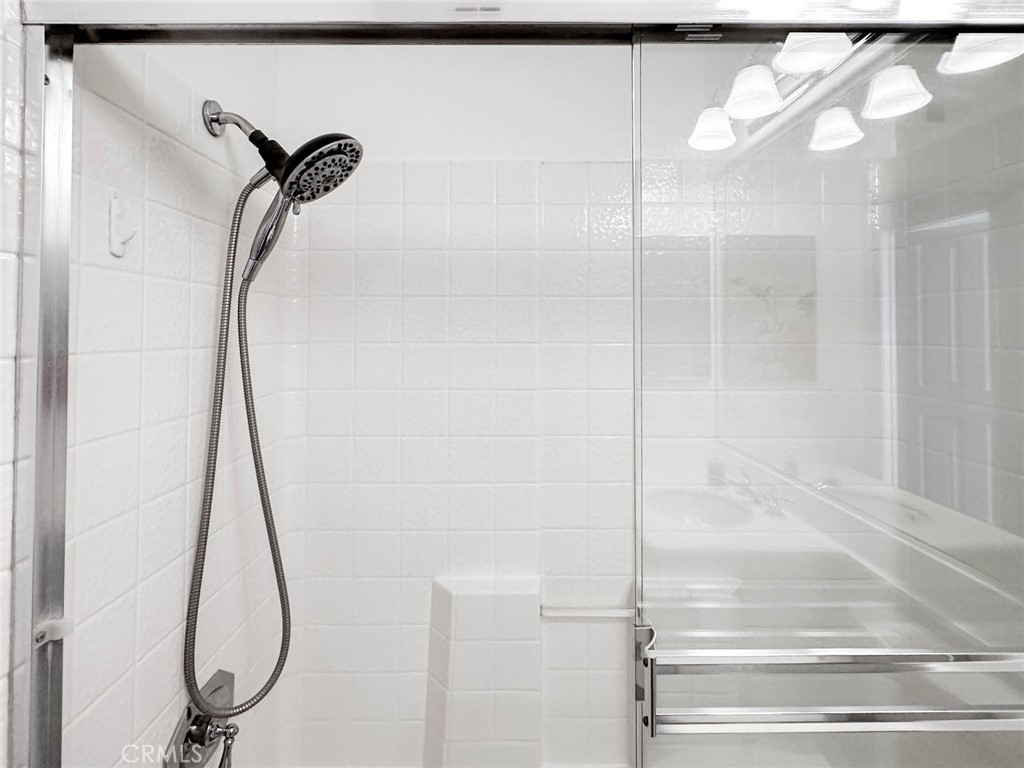 1 La Ronda Irvine, CA 92606 - Photo 21 of 29 a bathroom with a glass shower door