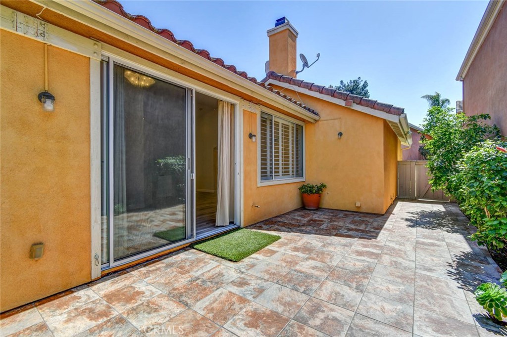 1 La Ronda Irvine, CA 92606 - Photo 22 of 29 a front view of a house with a yard