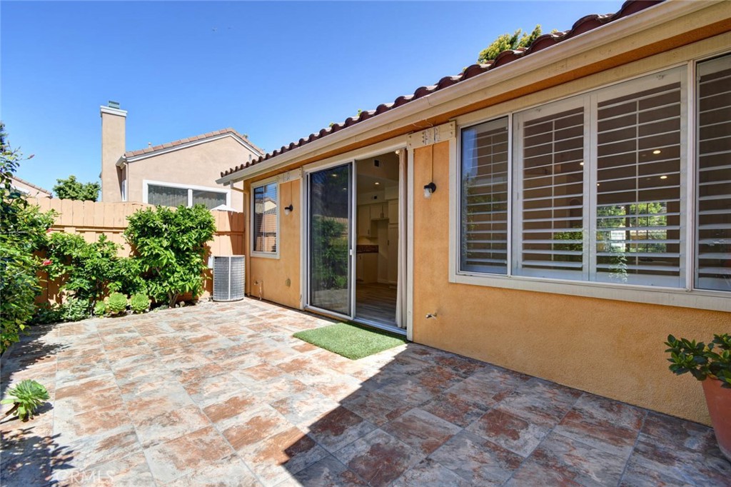1 La Ronda Irvine, CA 92606 - Photo 23 of 29 a front view of a house with a yard