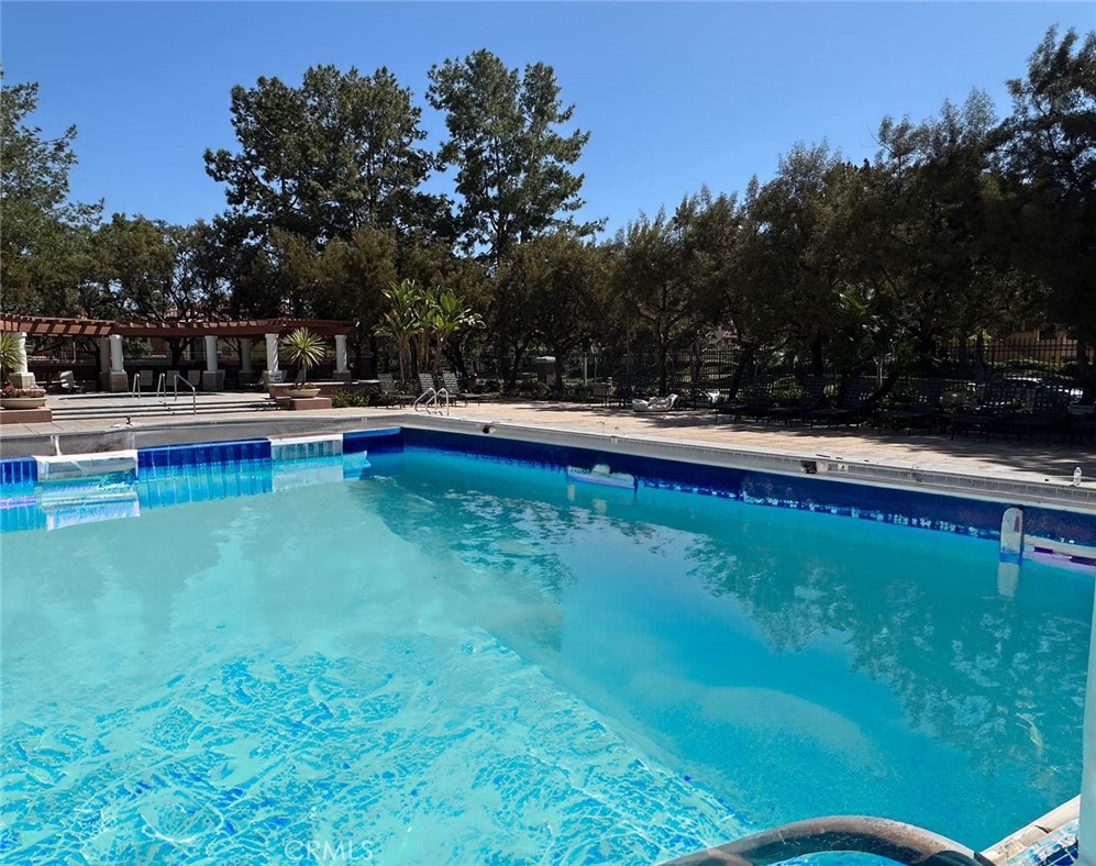 1 La Ronda Irvine, CA 92606 - Photo 28 of 29 a view of swimming pool with lawn chairs