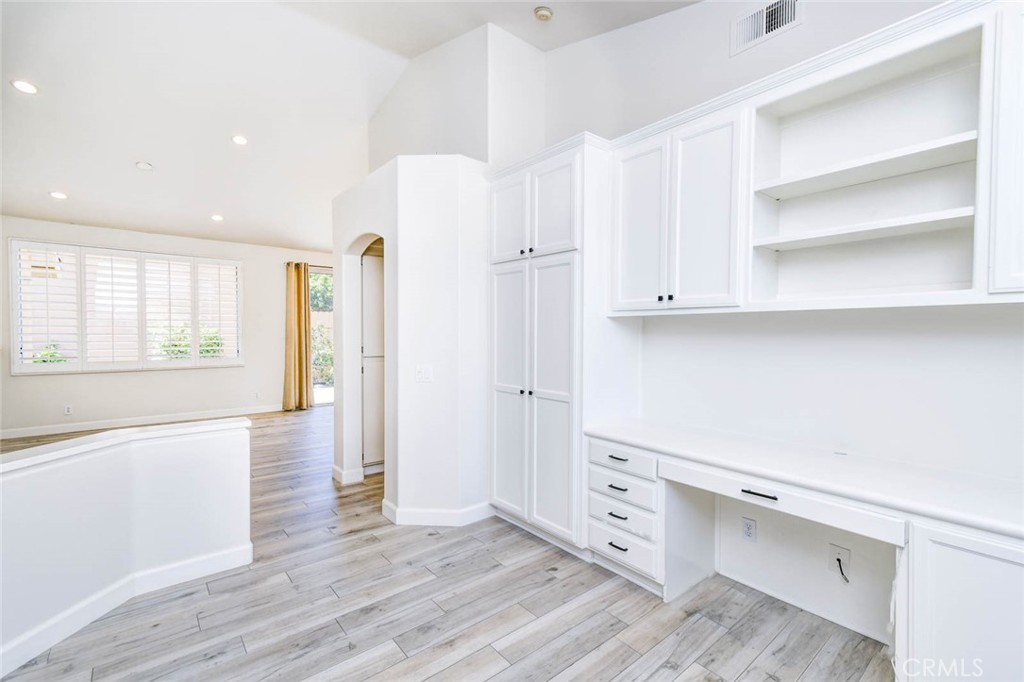 1 La Ronda Irvine, CA 92606 - Photo 5 of 29 a view of kitchen with wooden floor and electronic appliances