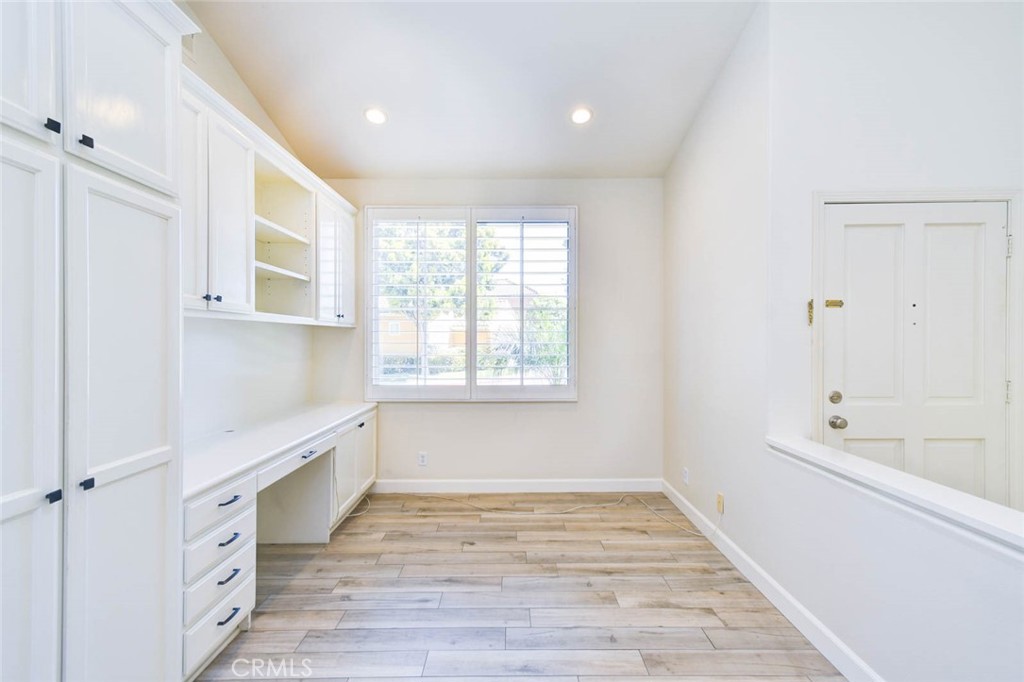 1 La Ronda Irvine, CA 92606 - Photo 6 of 29 a view of an empty room with wooden floor and a window