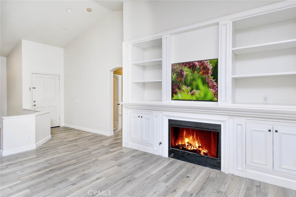 1 La Ronda Irvine, CA 92606 - Photo 7 of 29 a living room with furniture and a fireplace