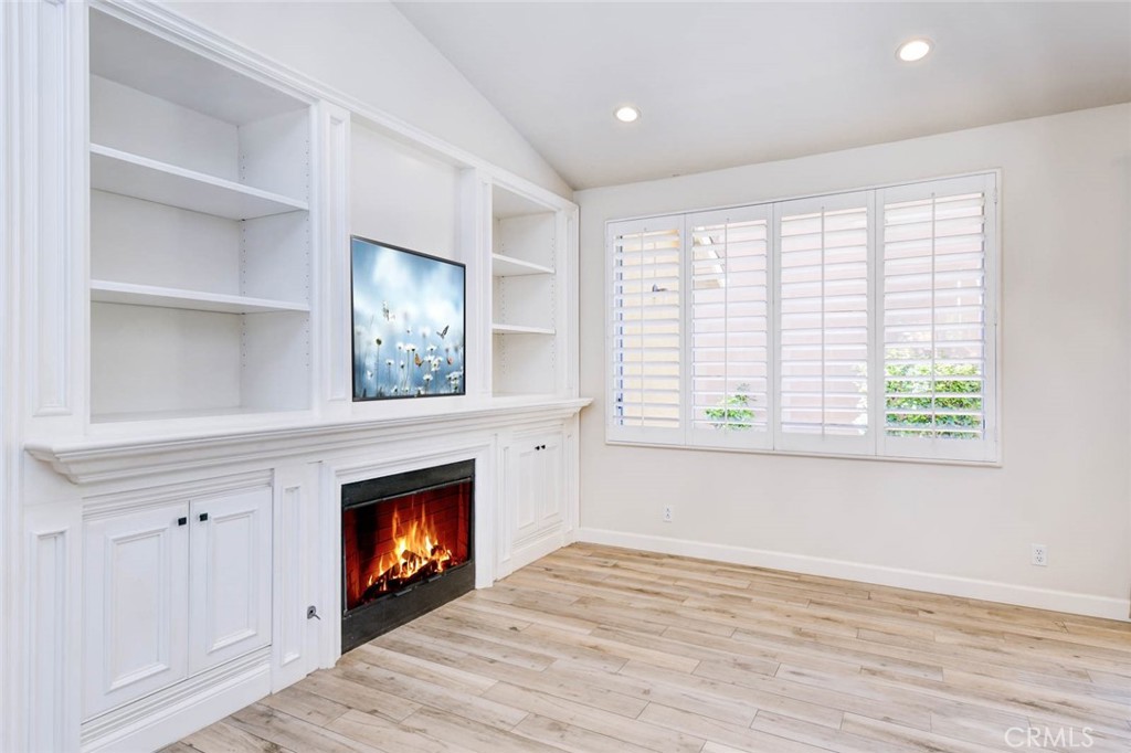 1 La Ronda Irvine, CA 92606 - Photo 8 of 29 a view of an empty room with a window and fireplace