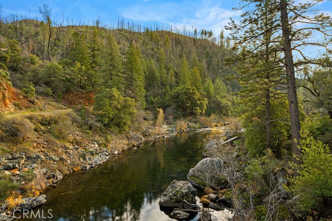 0 Jordan Hill Road Paradise, CA 95969 - Photo 24 of 27 a view of a lake with a building in the background