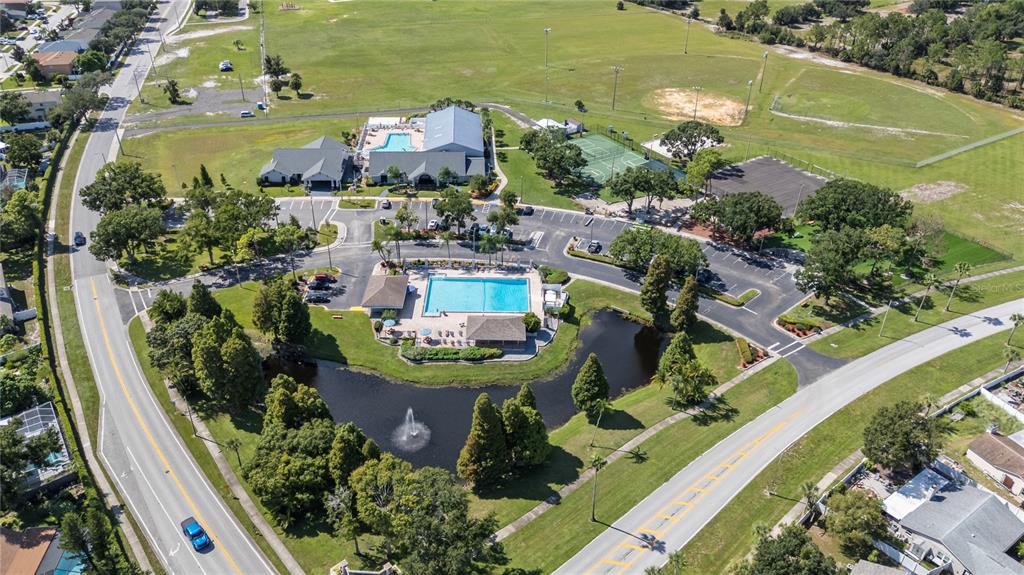 10901 Brickside Court Riverview, FL 33579 - Photo 33 of 36 an aerial view of a house with a garden and lake view